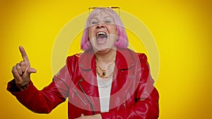 Senior old stylish granny woman showing loser gesture and pointing on you, laughing, bullying abuse