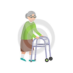 Senior old woman in green clothes walking with walker