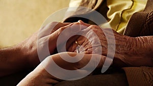 Senior old woman young man hold hand wrinkle skin close up 2