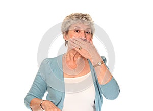 Senior older woman covering mouth