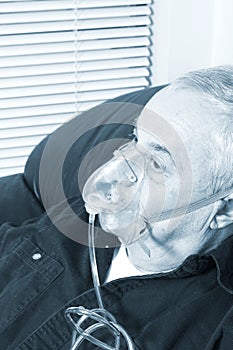 Senior with oxygen mask