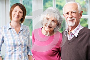 Senior Parents With Adult Daughter At Home photo