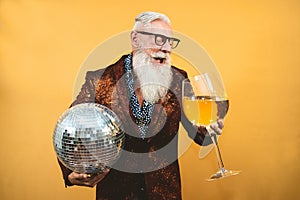 Senior party man celebrating new year`s eve in disco