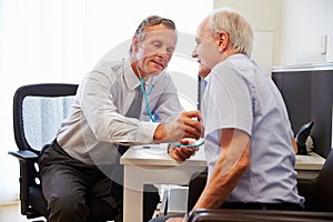 Senior Patient Having Medical Exam With Doctor In Office photo