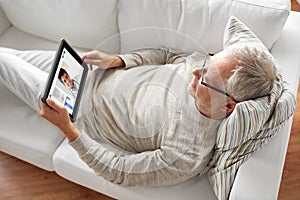 Senior patient having video chat with doctor