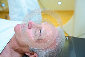 senior patient lying on hospital bed