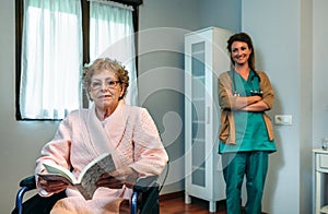 Senior patient posing with doctor in the background
