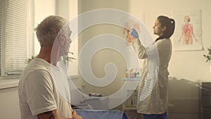 Senior patient preparing get injection vaccine in doctor office close up.