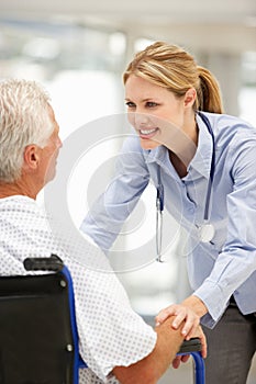 Senior patient with young female doctor