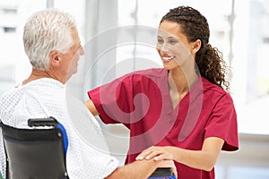 Senior patient with young female doctor