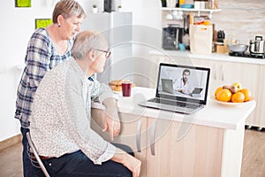 Senior patients on video call with doctor
