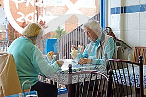 Senior pensioners eating meal out