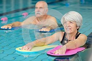 Senior people in aquatic fitness class