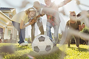 Senior people celebrating after scoring a goal while playing football