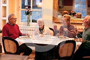 Senior people enjoy and smiling while eating dinner