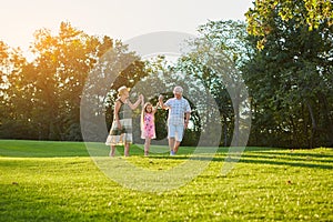 Senior people with granddaughter, nature.