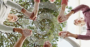 Senior, people and hands with unity for support with low angle, happy or celebration in nature. Elderly, women and