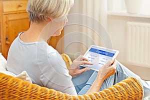 Woman tablet computer online banking photo