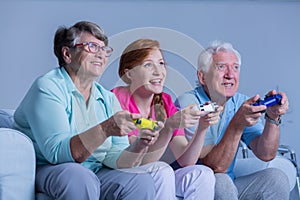Senior people playing video games