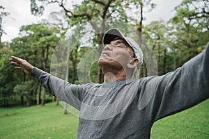 Senior people take a deep breath stretch out and raise arm