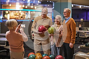 Senior People Taking Photos at Bowling