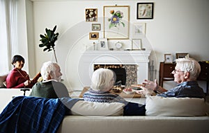 Senior people talking in a living room photo