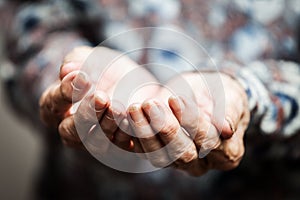 Senior person hands begging for food or help