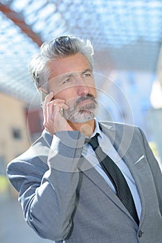 Senior on phone with important news photo