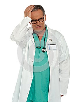 Senior physician having headache