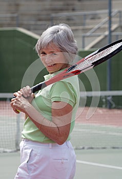 Senior Playing Tennis