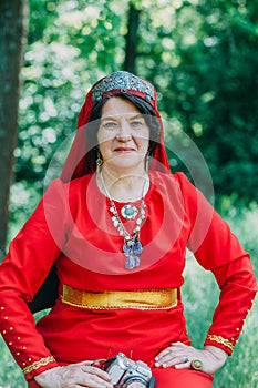 the senior priestess with a butterfly on her fingers prepared for the rite of sacrifice. mystical pagan rite. pagans