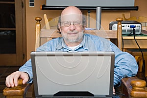 Senior professor with laptop