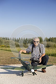Senior RC modeller and his new plane model