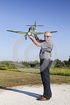 Senior RC modeller and his new plane model