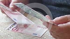 Senior retire woman counting little euro money