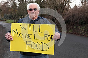 Senior retired man model with sign