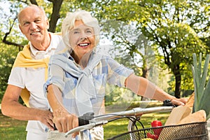 Senior riding tandem bike