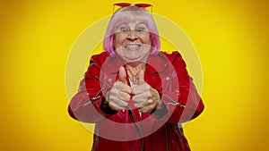 Senior rocker old woman wish for good luck waiting lottery winning, great fortune, celebrating happy