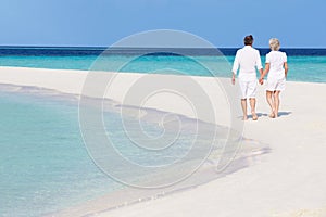 Senior Romantic Couple Walking On Beautiful Tropical Beach