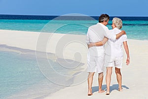 Senior Romantic Couple Walking On Beautiful Tropical Beach