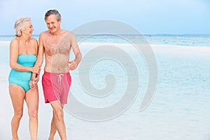 Senior Romantic Couple Walking In Beautiful Tropical Sea