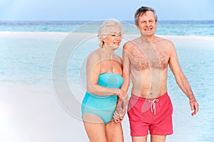 Senior Romantic Couple Walking In Beautiful Tropical Sea