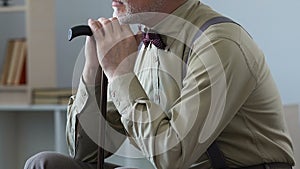 Senior sad man sitting in room napping, old age loneliness in nursing home