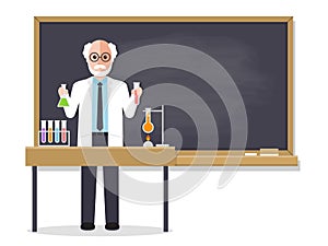 Senior science teacher teaching student in classroom