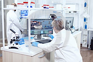 Senior scientist in pharmaceuticals laboratory doing genetic research