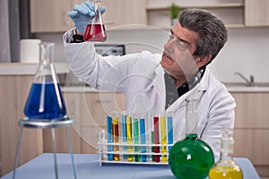 Senior scientist researching in laboratory