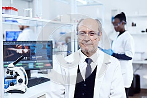 Senior scientist sitting at his workplace