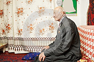 Senior serene man on sofa