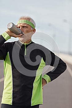 Senior Sportsman Drinking Water
