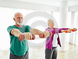 senior stretching exercise woman training lifestyle sport fitness home healthy gym exercising fit man couple team